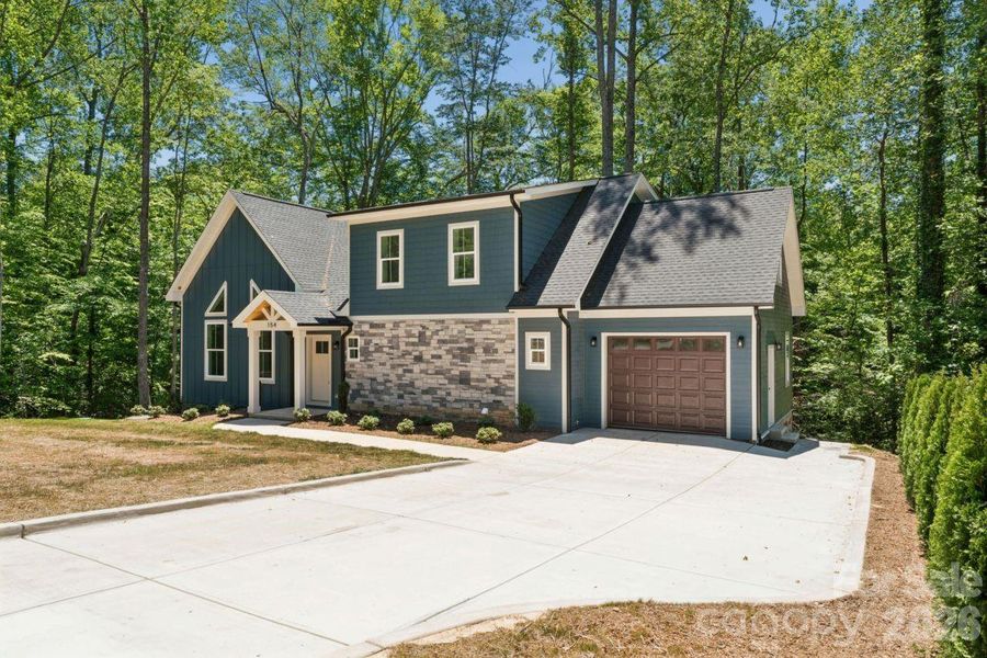 Front exterior of a new home in , Troutman, NC, highlighting curb appeal (Image 16).