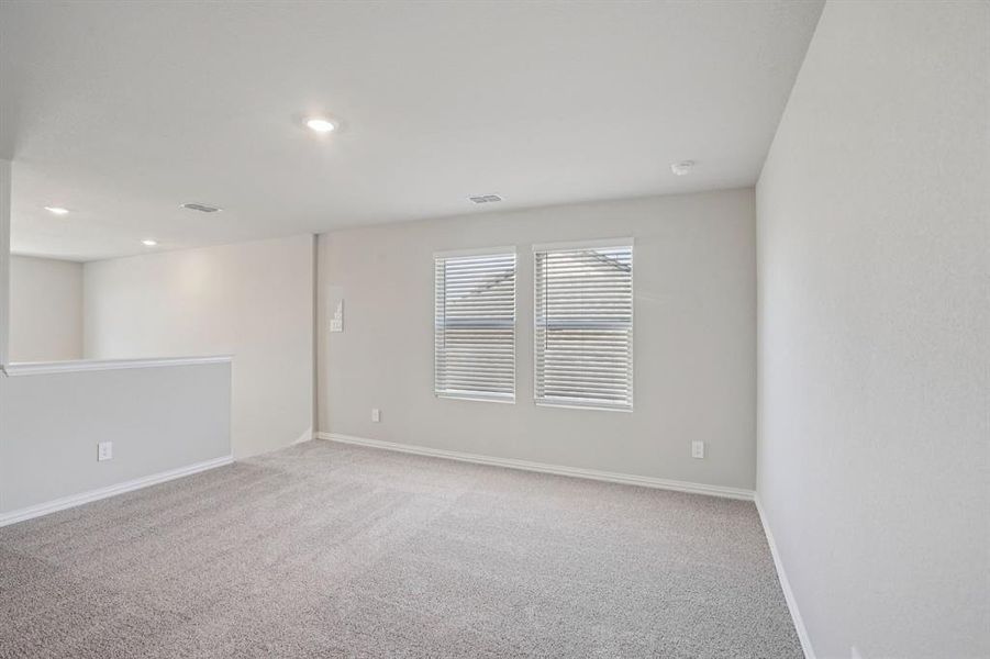 Unfurnished room featuring light colored carpet and recessed lighting