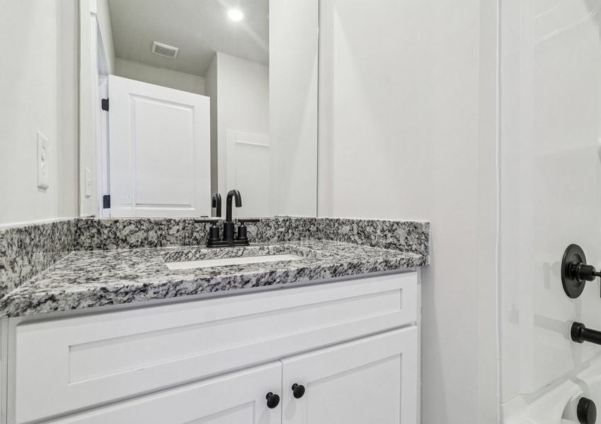 The bathrooms have granite countertops.