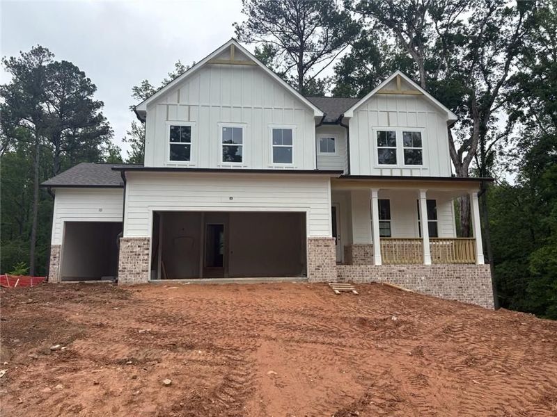 Front exterior of a new home in Riverwood, Dallas, GA, highlighting curb appeal (Image 83). Front exterior of a new home in Riverwood, Dallas, GA, highlighting curb appeal (Image 83).