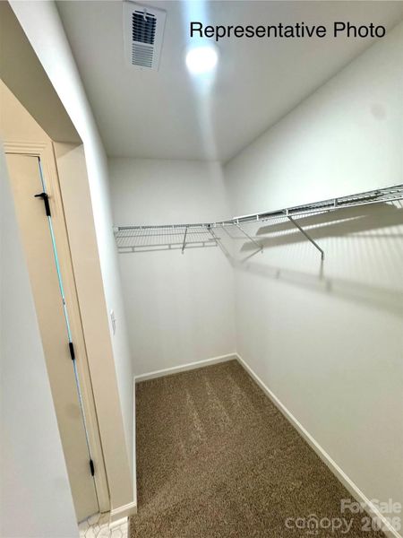 Primary Bedroom walk in closet Primary Bedroom walk in closet