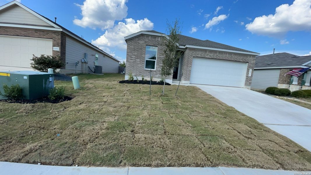 Front exterior of a new home in Waterwheel, San Antonio, TX, highlighting curb appeal (Image 2).