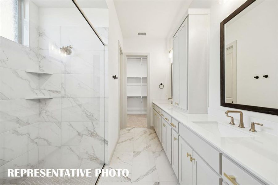 With a spacious walk in shower and wonderful closet featuring seasonal hanging space, this owner's bath offers everything you have been searching for!  REPRESENTATIVE PHOTO