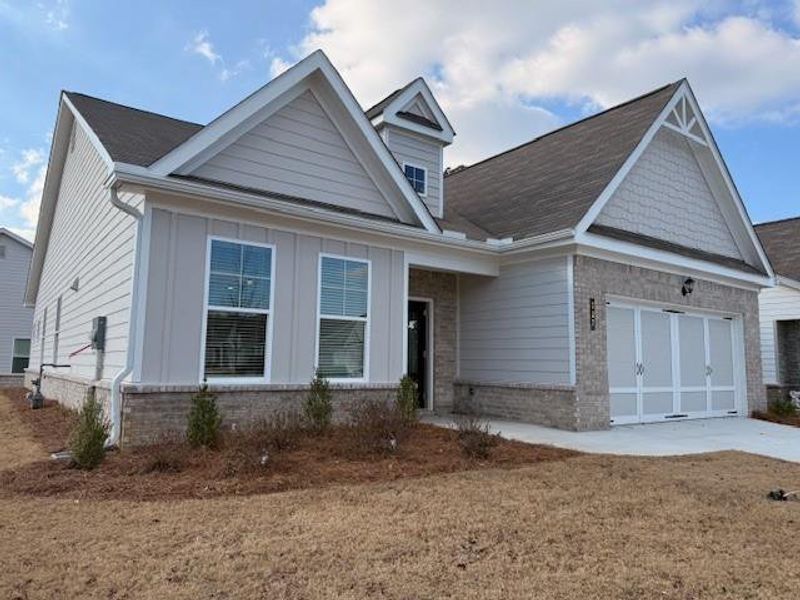Front exterior of a new home in Cooper's Walk, Loganville, GA, highlighting curb appeal (Image 2). Front exterior of a new home in Cooper's Walk, Loganville, GA, highlighting curb appeal (Image 2).