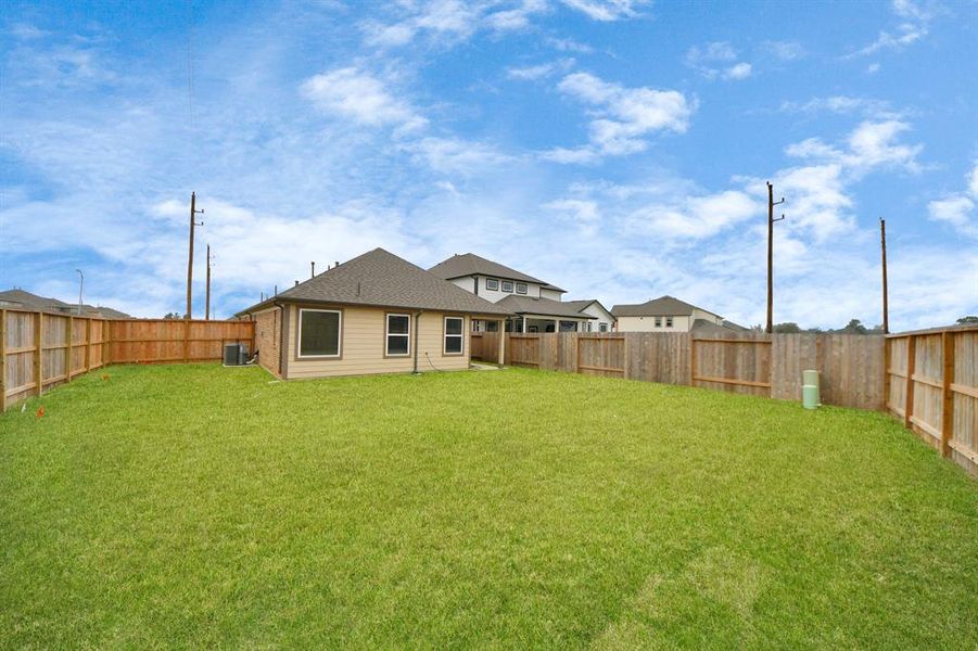 Backyard retreat, offering an abundance of space for kids to play and explore. The possibilities are endless in this outdoor haven, where the joy of open-air activities and family gatherings awaits.