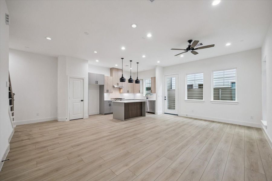 Expansive main living area with seamless flow into the kitchen Expansive main living area with seamless flow into the kitchen