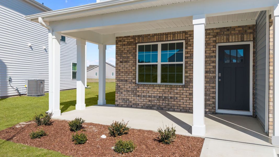 Exterior details and patio area of a home in Ridgewood Farms, Winterville (Image 3).