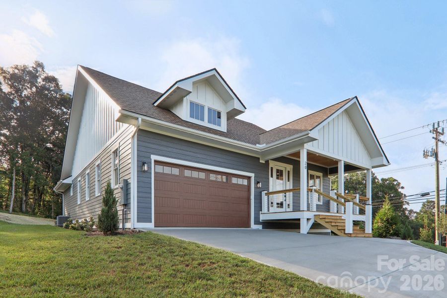 Front exterior of a new home in , Hendersonville, NC, highlighting curb appeal (Image 19).