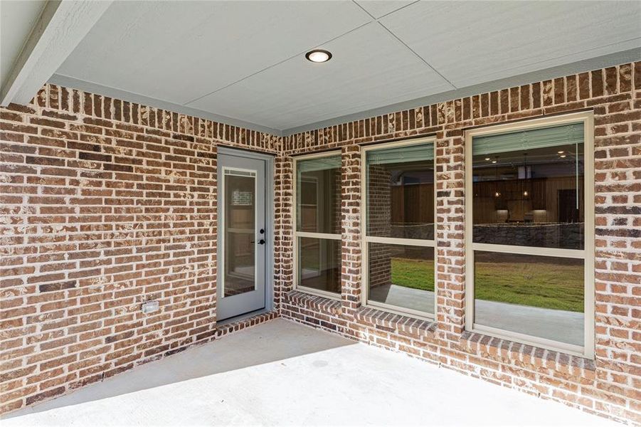 Exterior details and patio area of a home in Creekview Meadows, Pilot Point (Image 4). Exterior details and patio area of a home in Creekview Meadows, Pilot Point (Image 4).