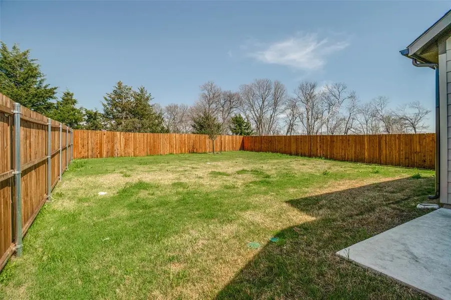 View of fenced backyard