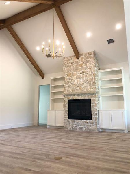 The huge cathedral ceilings are a true showstopper, with exposed wood beams that add character and grandeur to the space, making it the perfect setting for both relaxation and entertaining.