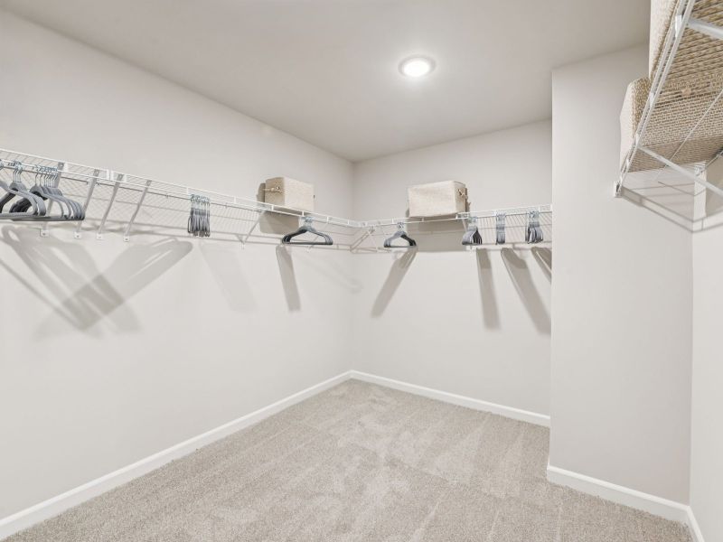 Walk-in closet in the Taylorsville floorplan at a Meritage Homes community in Mebane, NC. Walk-in closet in the Taylorsville floorplan at a Meritage Homes community in Mebane, NC.