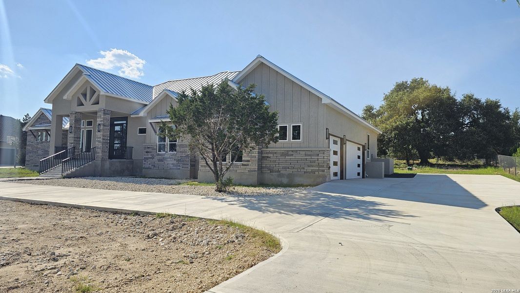 Front exterior of a new home in , New Braunfels, TX, highlighting curb appeal (Image 30).