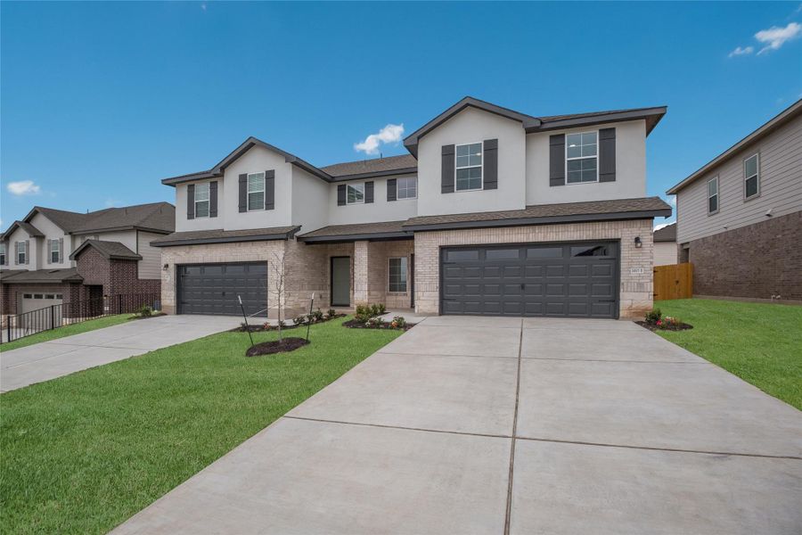 Front exterior of a new home in Palomino, Manor, TX, highlighting curb appeal (Image 20). Front exterior of a new home in Palomino, Manor, TX, highlighting curb appeal (Image 20).