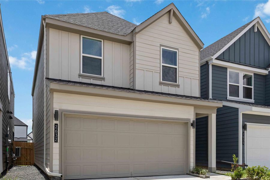 Front exterior of a new home in Grand West, Houston, TX, highlighting curb appeal (Image 1). Front exterior of a new home in Grand West, Houston, TX, highlighting curb appeal (Image 1).