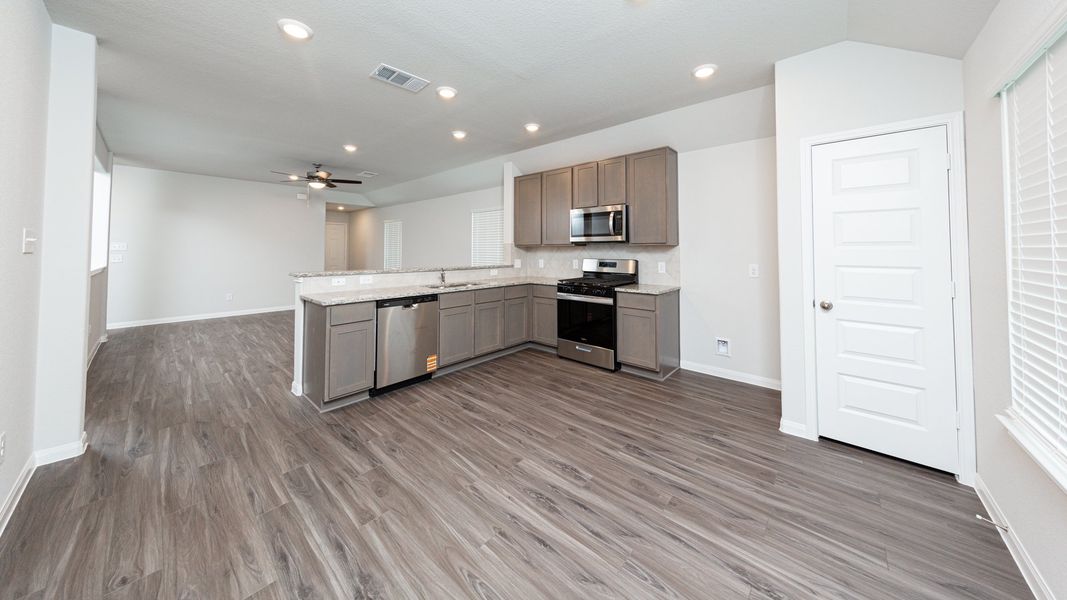 Kitchen and Dining Area to Family Room