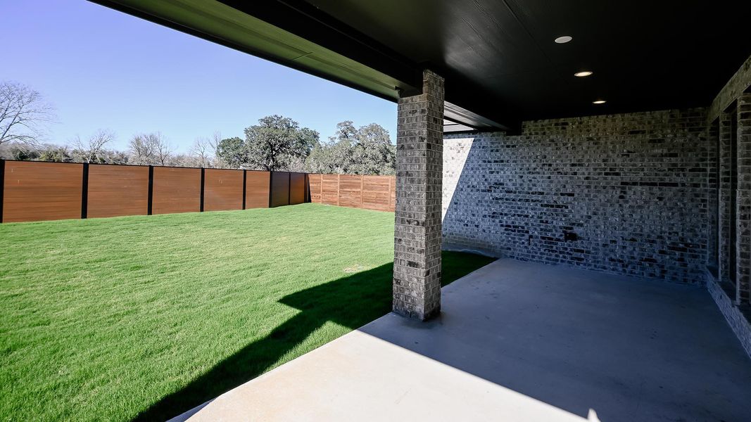 Exterior details and patio area of a home in Juniper Springs, Lockhart (Image 3).