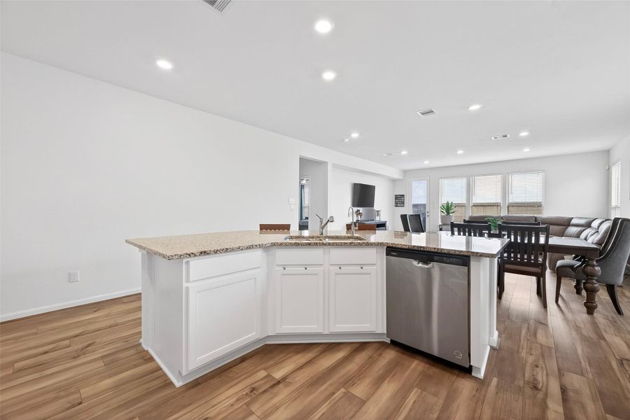 Working kitchen island features the sink and dishwasher