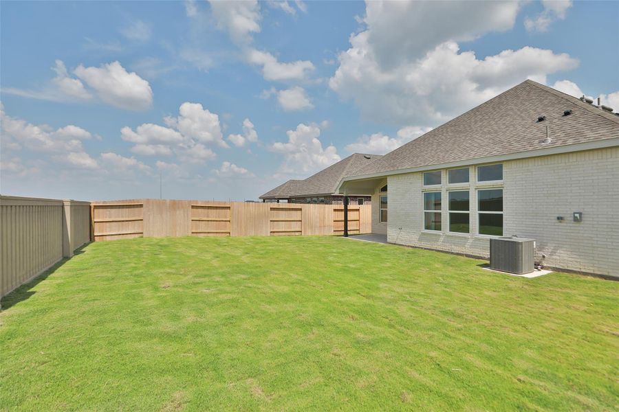 Exterior details and patio area of a home in Creekhaven, Iowa Colony (Image 2). Exterior details and patio area of a home in Creekhaven, Iowa Colony (Image 2).