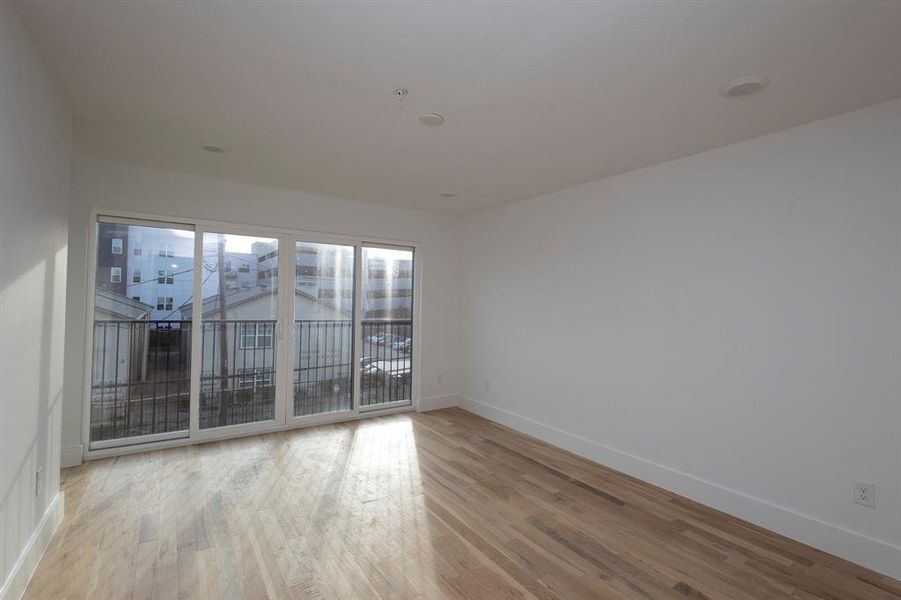 Empty room with baseboards and wood finished floors