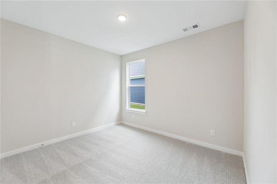 Spacious, unfurnished interior of a new home in The Park at Brighton, Locust Grove (Image 30).