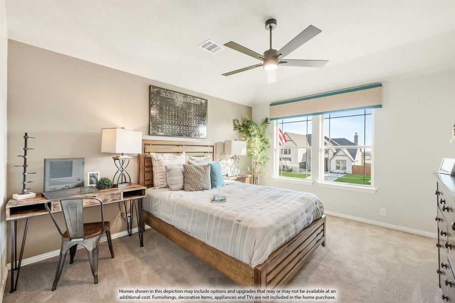 Bedroom with wood-frame bed, ceiling fan, carpet, and desk area near a large window