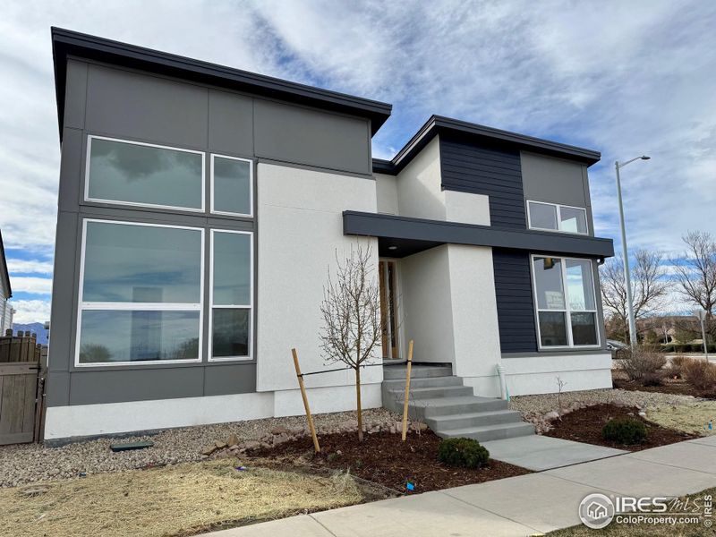 Front exterior of a home in the West Grange community, located in Longmont, CO (Image 6).