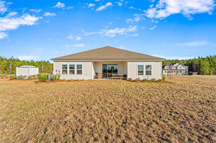 Front exterior of a new home in The Cypress Series at Reserve East, Flagler Beach, FL, highlighting curb appeal (Image 21). Front exterior of a new home in The Cypress Series at Reserve East, Flagler Beach, FL, highlighting curb appeal (Image 21).