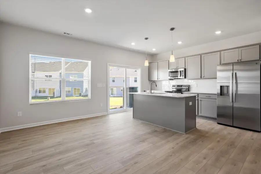 Furnished interior view inside a new home in West Main Townhomes, Sanford (Image 5).
