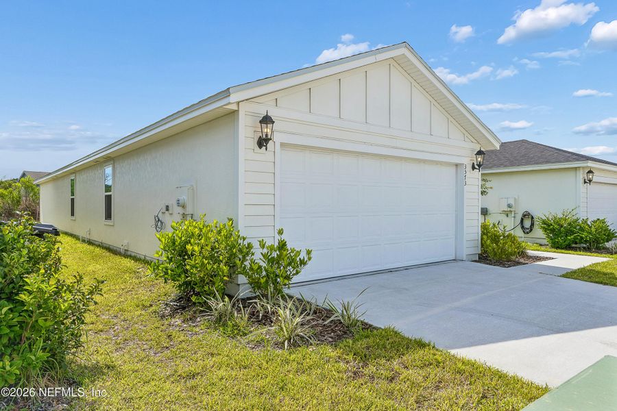Front exterior of a new home in Lakes at Bella Lago – Classic Series, Green Cove Springs, FL, highlighting curb appeal (Image 20).