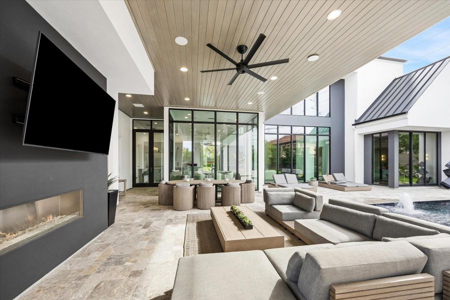 Outdoor fireplace and TV. There is also a LARGE outdoor storage closet. Outdoor fireplace and TV. There is also a LARGE outdoor storage closet.