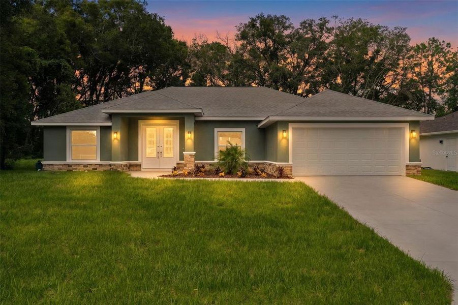 Front exterior of a new home in , Summerfield, FL, highlighting curb appeal (Image 22).