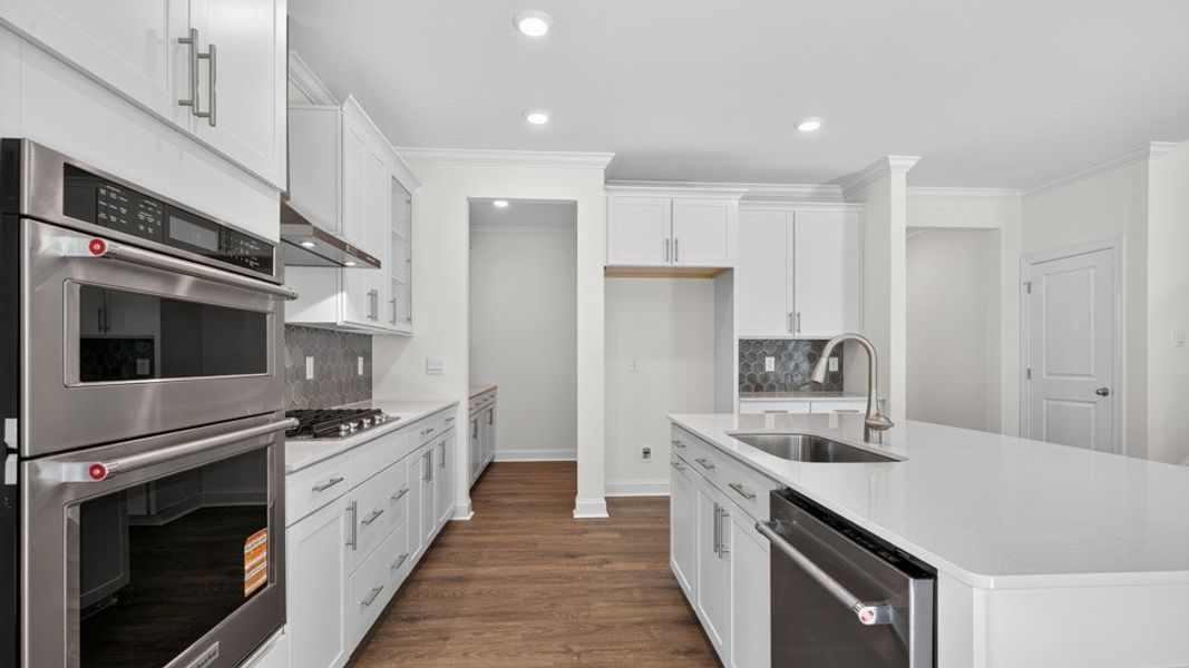 Furnished interior view inside a new home in The Manors at Winston Pointe, Clayton (Image 5). Furnished interior view inside a new home in The Manors at Winston Pointe, Clayton (Image 5).