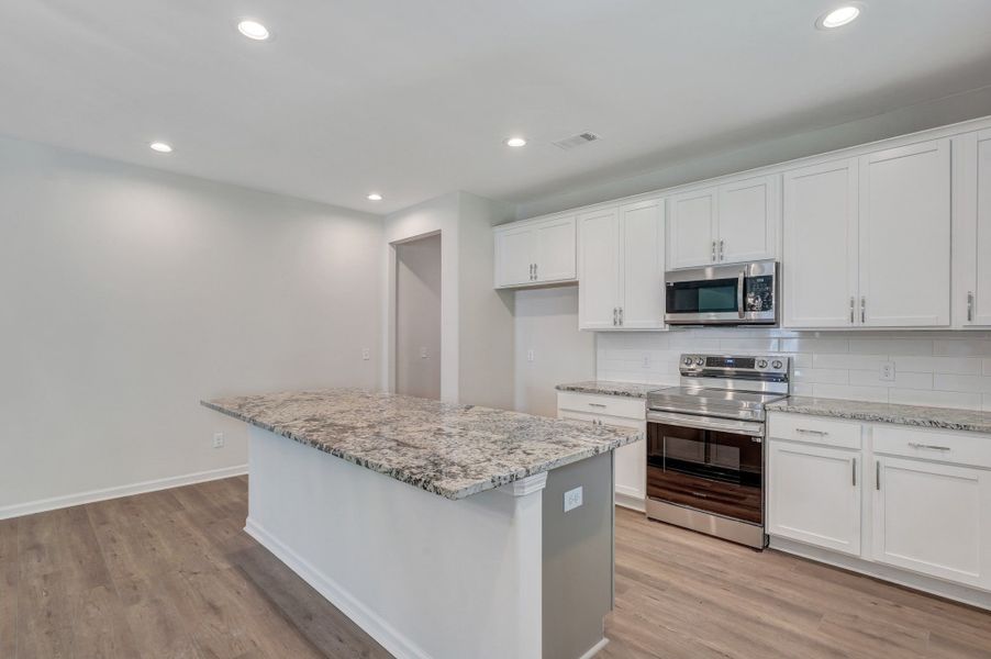 Representative furnished interior of a home built from the The Stonecrest by Smith Family Homes in Ramsey Landing, Rincon (Image 16).