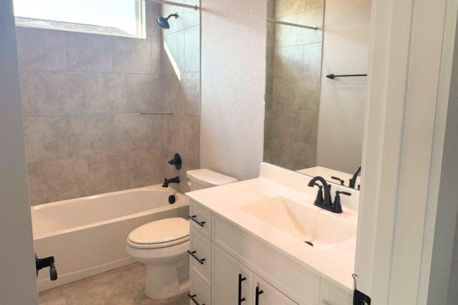 Full bathroom with vanity and tub / shower combination Full bathroom with vanity and tub / shower combination