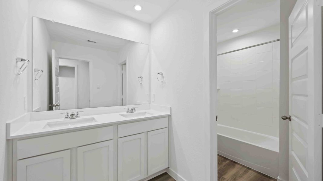 Representative furnished interior of a home built from the Magnolia by D.R. Horton in Grand West, Houston (Image 13).