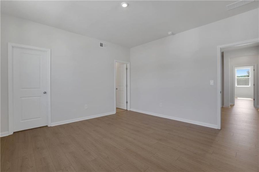 Spacious, unfurnished interior of a new home in The Paddocks at Doc Hughes, Buford (Image 32).