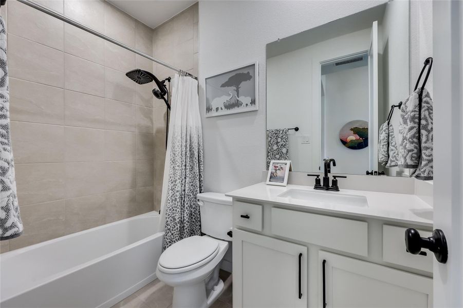 Clean lines and a tiled shower tub alcove define this modern bathroom. Clean lines and a tiled shower tub alcove define this modern bathroom.