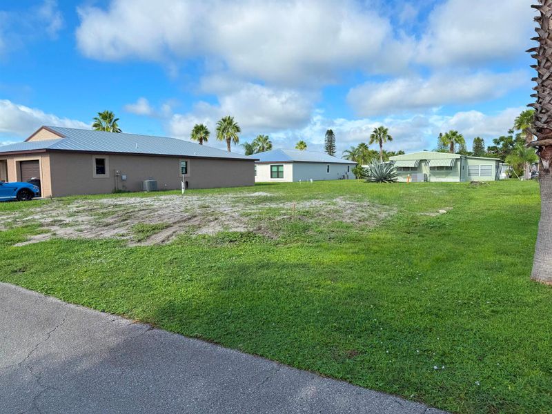 Front exterior of a new home in , Port St. Lucie, FL, highlighting curb appeal (Image 10).