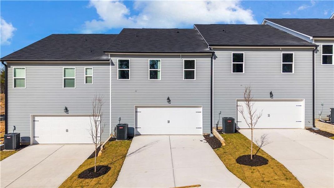 Front exterior of a new home in , Conyers, GA, highlighting curb appeal (Image 24).