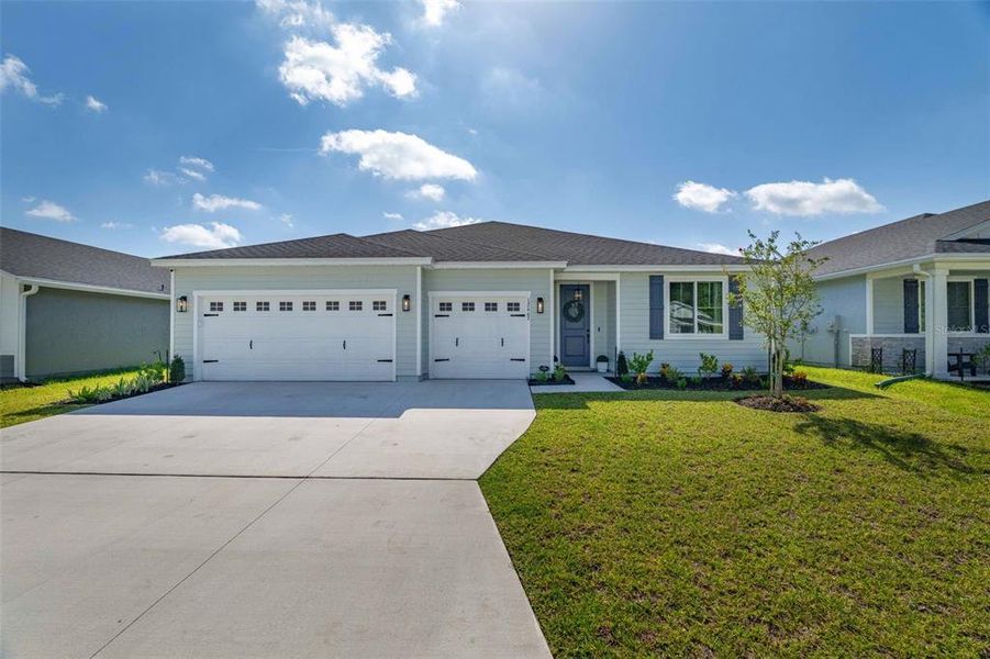 Front exterior of a new home in Azalea Creek, Jacksonville, FL, highlighting curb appeal (Image 1). Front exterior of a new home in Azalea Creek, Jacksonville, FL, highlighting curb appeal (Image 1).