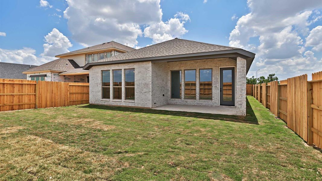 Exterior details and patio area of a home in Lakes of Cane Island, Katy (Image 3).