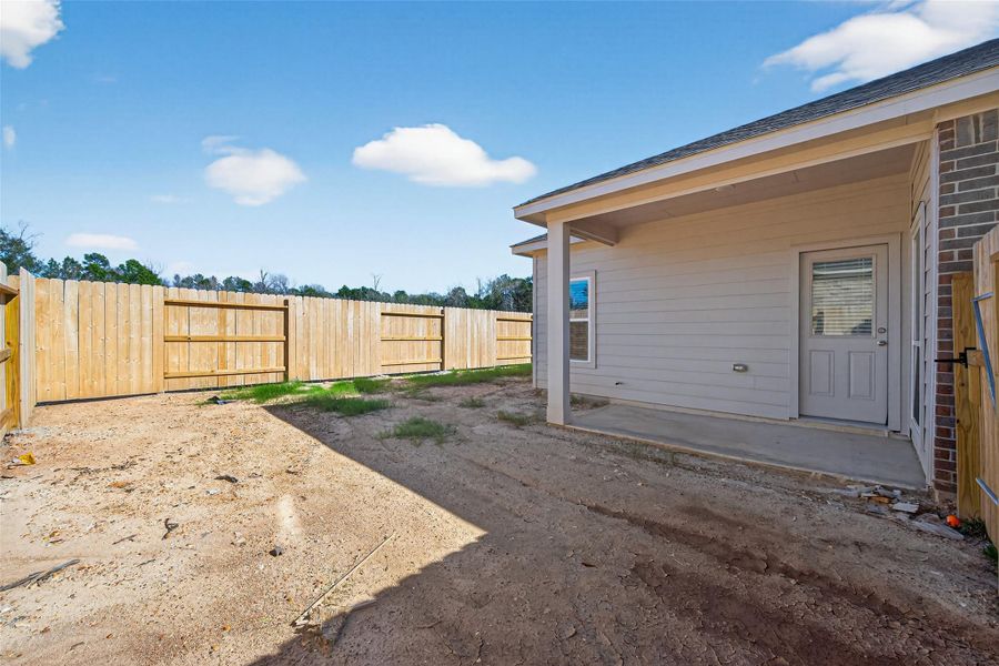 Exterior details and patio area of a home in Enclave at Willis, Willis (Image 21).