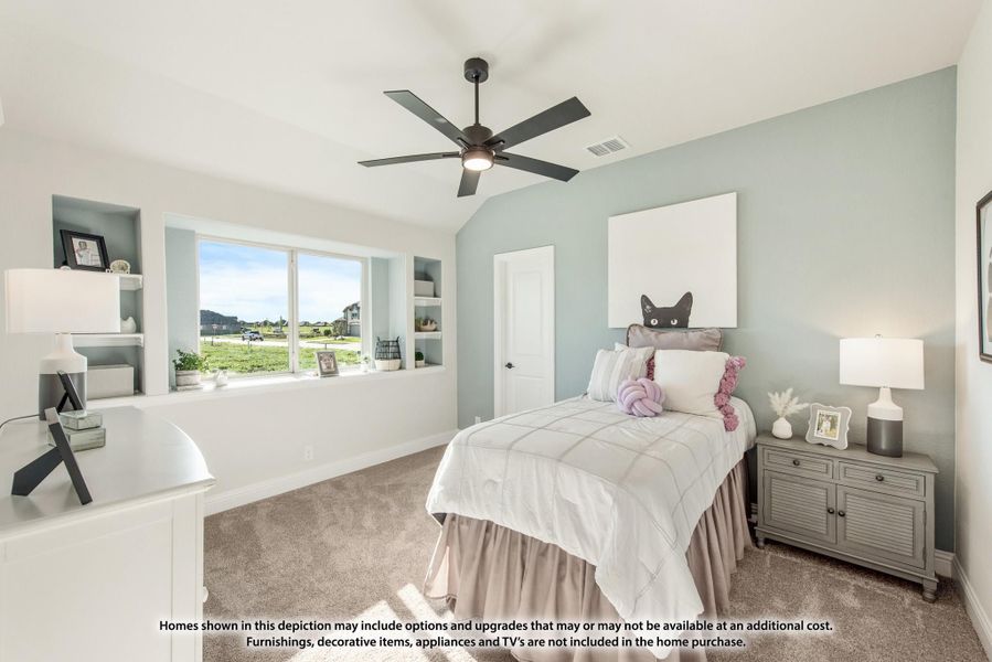 Bedroom with light blue walls, ceiling fan, built-in shelves, and large window overlooking yard