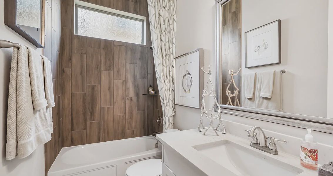 Representative furnished interior of a home built from the Lynnbrook by Chesmar Homes in Sienna Chateau, Missouri City (Image 10).