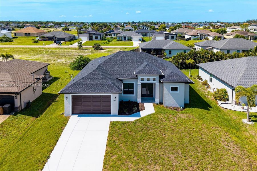 Front exterior of a new home in , Cape Coral, FL, highlighting curb appeal (Image 1). Front exterior of a new home in , Cape Coral, FL, highlighting curb appeal (Image 1).
