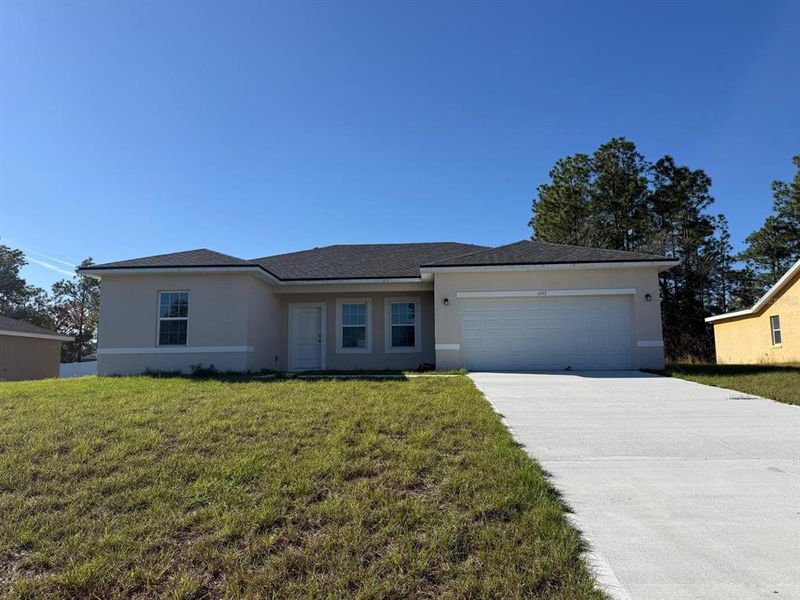 Front exterior of a new home in , Ocala, FL, highlighting curb appeal (Image 1). Front exterior of a new home in , Ocala, FL, highlighting curb appeal (Image 1).