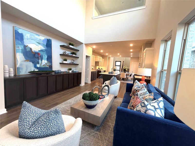 This stunning family room features soaring 20ft ceilings.