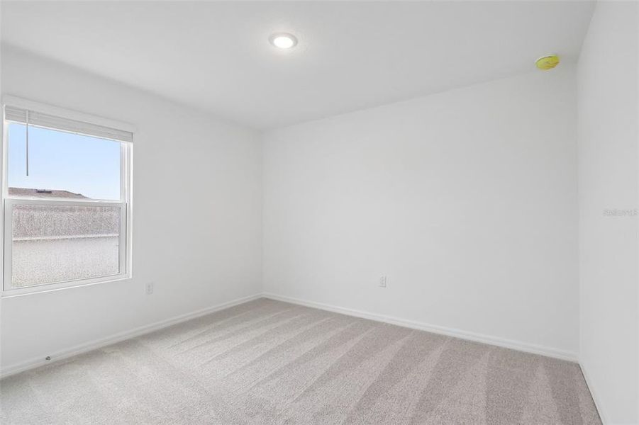 Spacious, unfurnished interior of a new home in Eagletail Landings, Howey-in-the-Hills (Image 32).