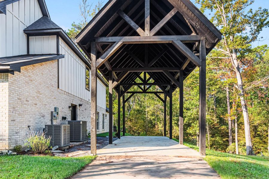 Protect that RV or the outdoor toys under this wooden gabled cover. Protect that RV or the outdoor toys under this wooden gabled cover.